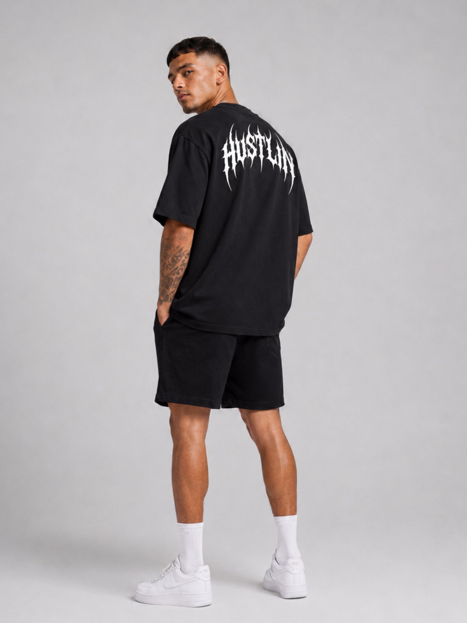 Camiseta Oversized Hustlin Disturbed